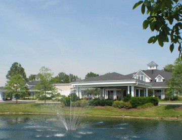 manor house exterior entrance by lake